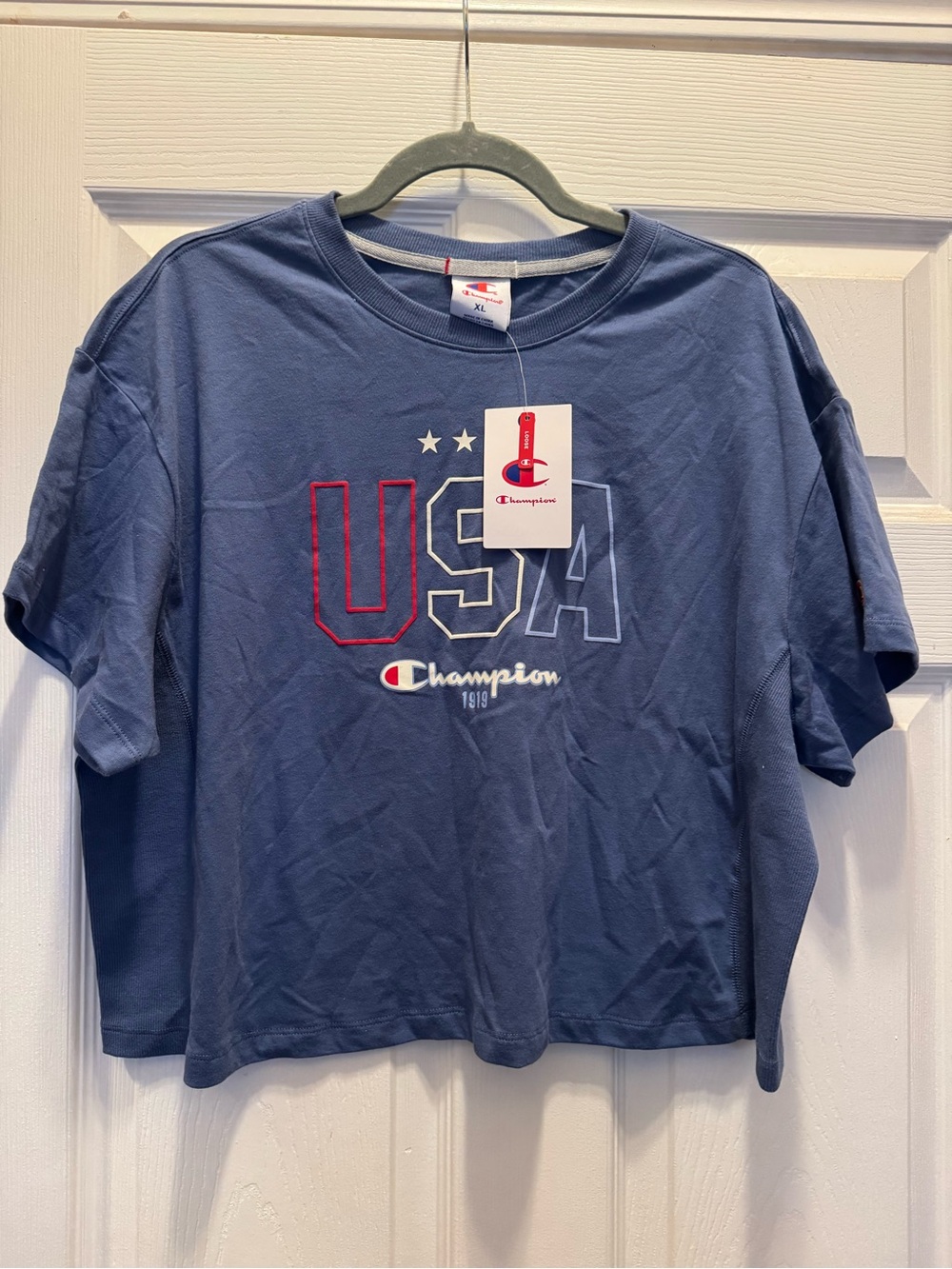 Women’s Champion Blue  USA Graphic crop style Tee with Red & White Accents